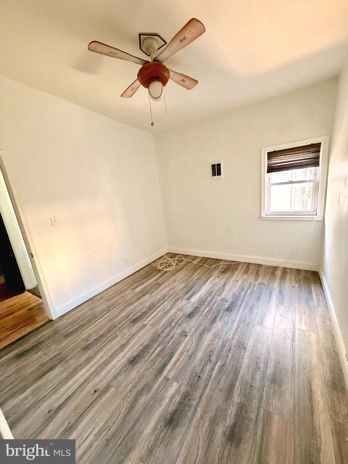 1944 Palethorp Street Philadelphia, PA 19122 - Photo 13 of 14 Bright room with wood flooring and ceiling fan