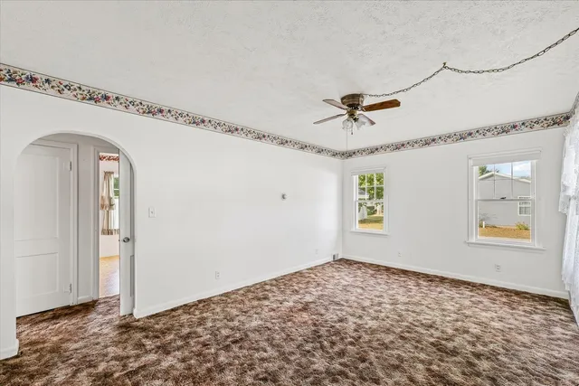 a view of a hallway with a chandelier