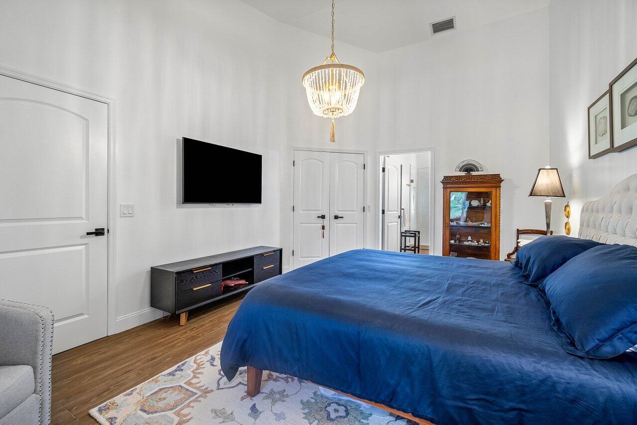 8195 Mooring Circle Boynton Beach, FL 33472 - Photo 13 of 28 a bedroom with a bed and a television