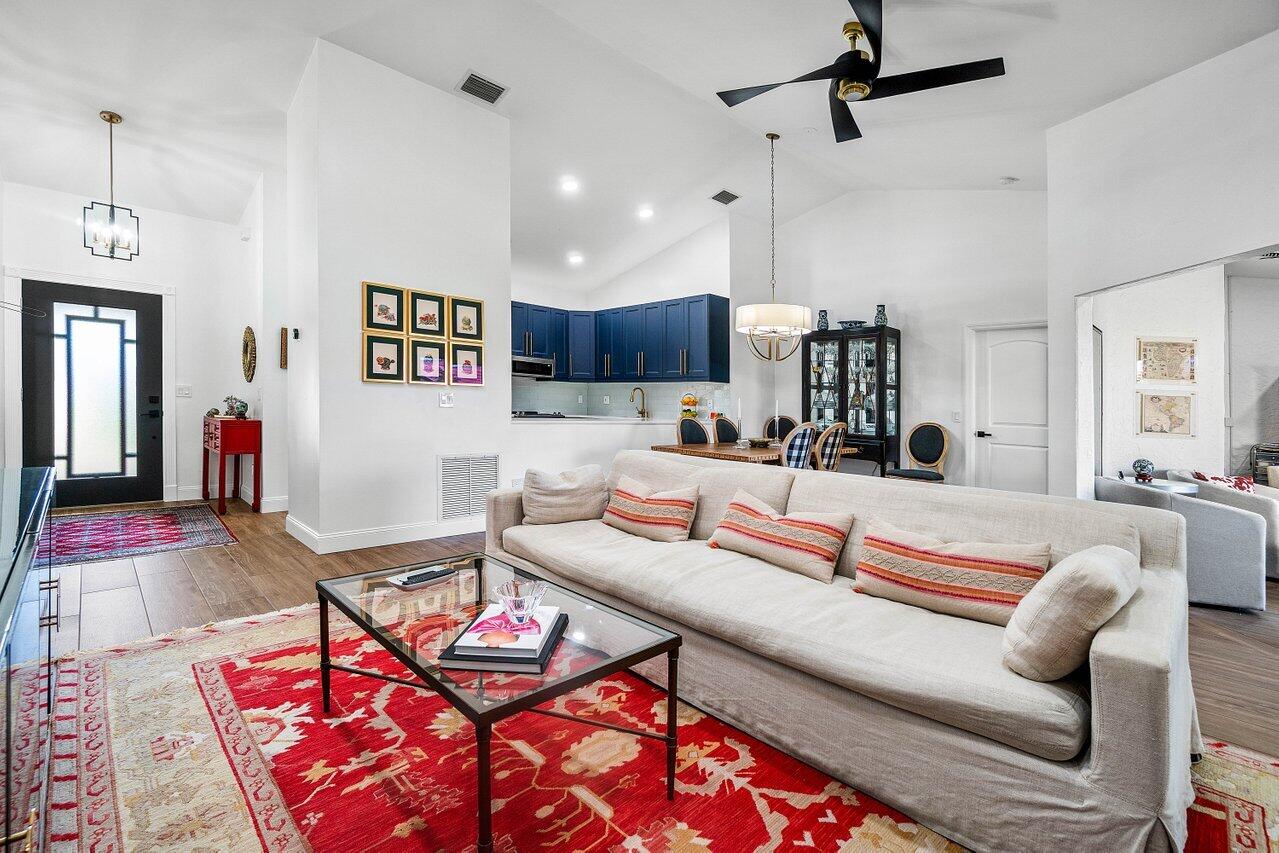 8195 Mooring Circle Boynton Beach, FL 33472 - Photo 7 of 28 a living room with furniture and wooden floor