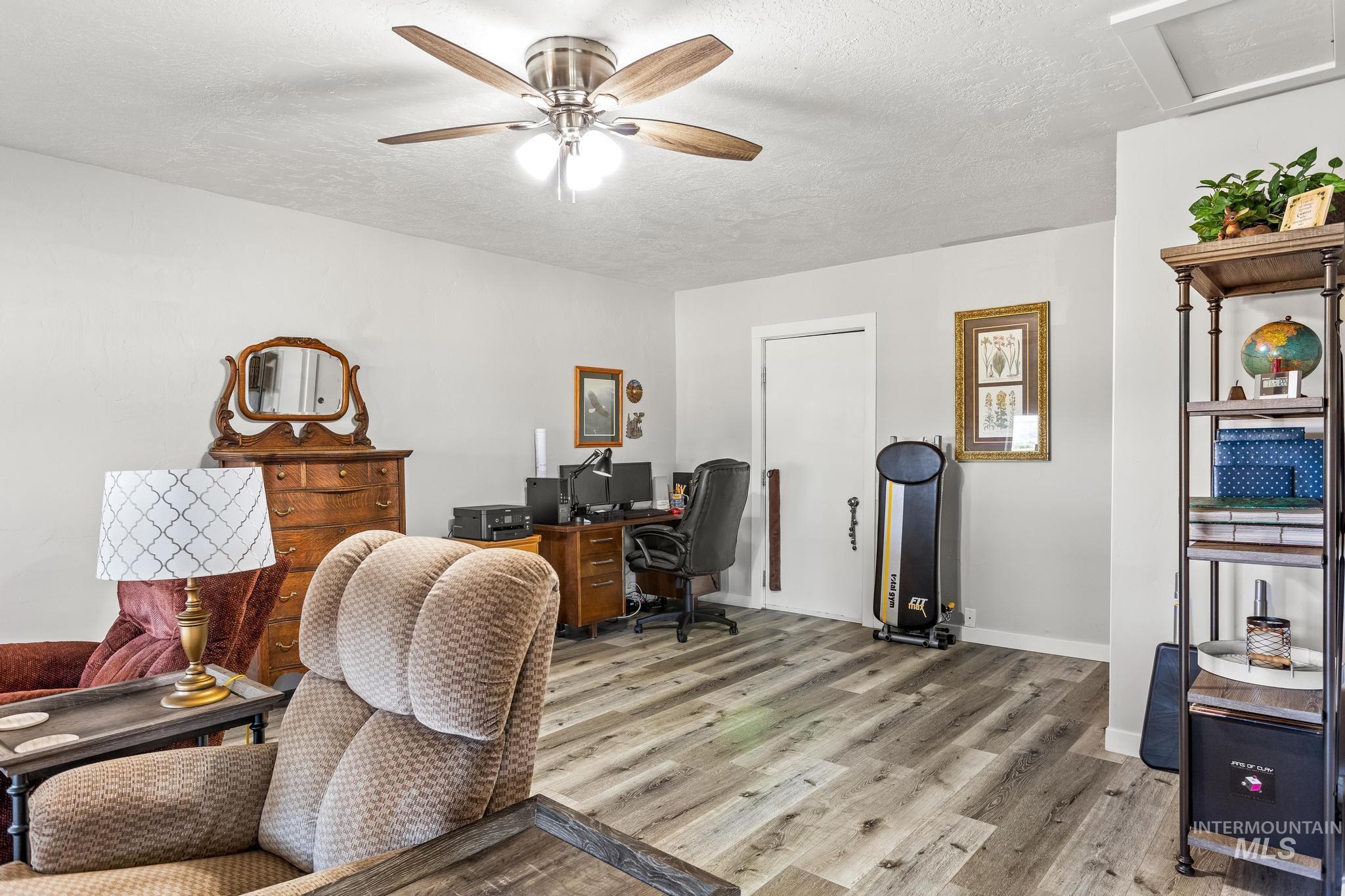 2208 Keithley Creek Road Midvale, ID 83645 - Photo 23 of 45 Office featuring light wood-type flooring, a ceiling fan, a textured ceiling, and attic access