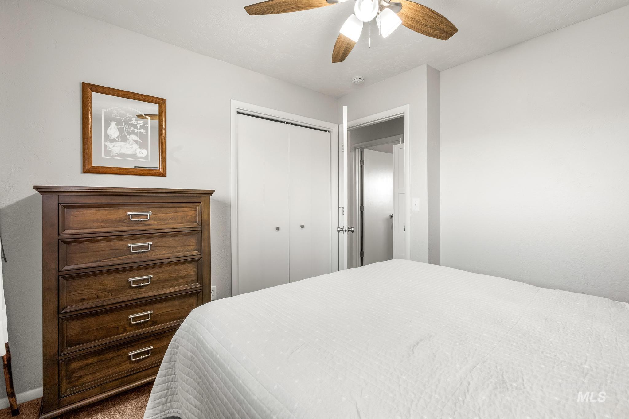 2208 Keithley Creek Road Midvale, ID 83645 - Photo 28 of 45 Carpeted bedroom with a closet and a ceiling fan