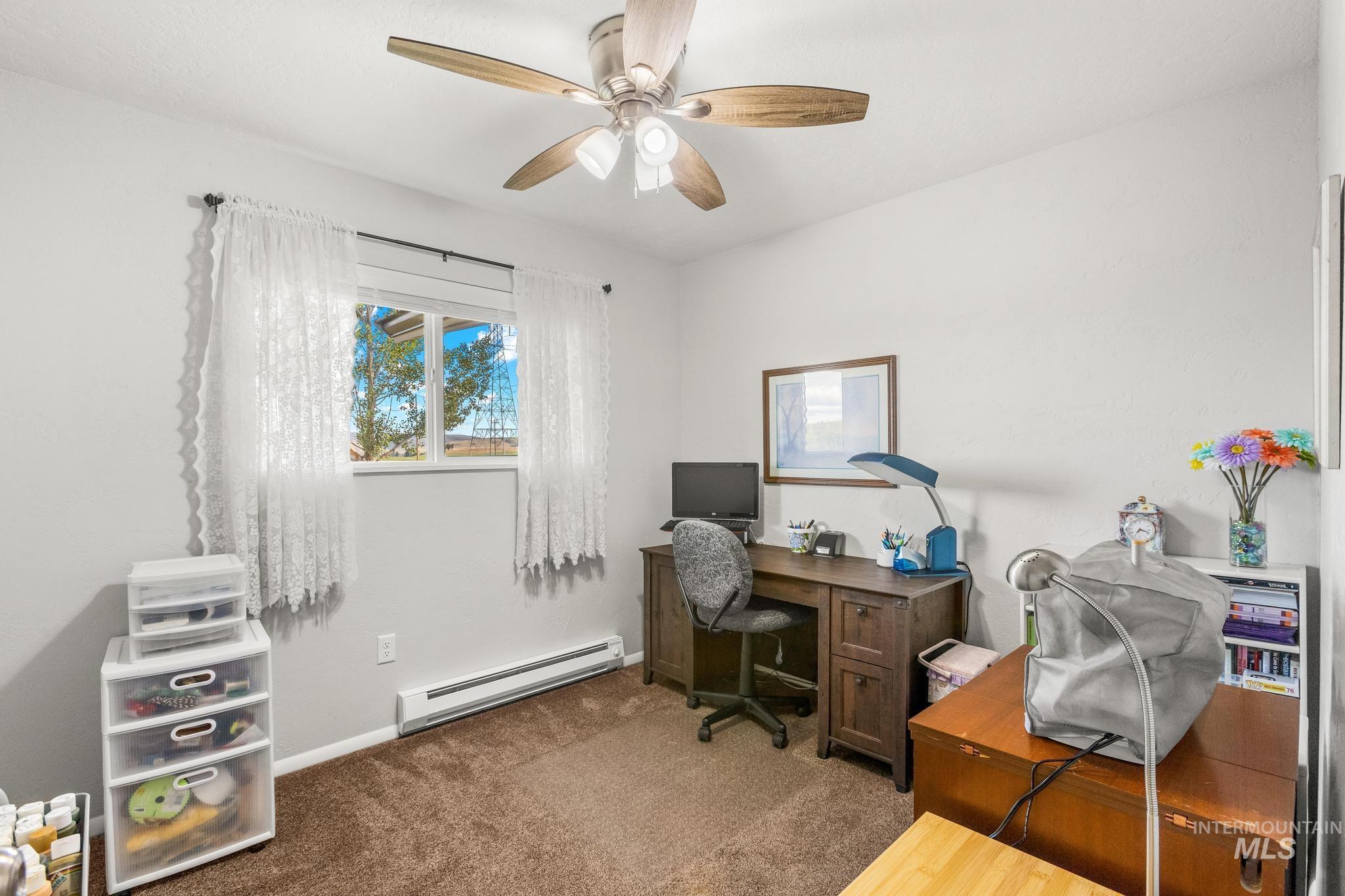 2208 Keithley Creek Road Midvale, ID 83645 - Photo 31 of 45 Carpeted office with baseboard heating and ceiling fan
