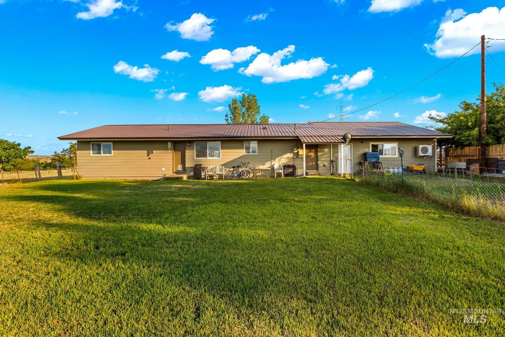 2208 Keithley Creek Road Midvale, ID 83645 - Photo 35 of 45 Back of property featuring a metal roof