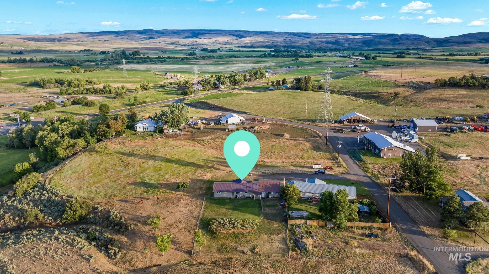 2208 Keithley Creek Road Midvale, ID 83645 - Photo 40 of 45 Aerial view of property and surrounding area with a mountain backdrop and rural landscape