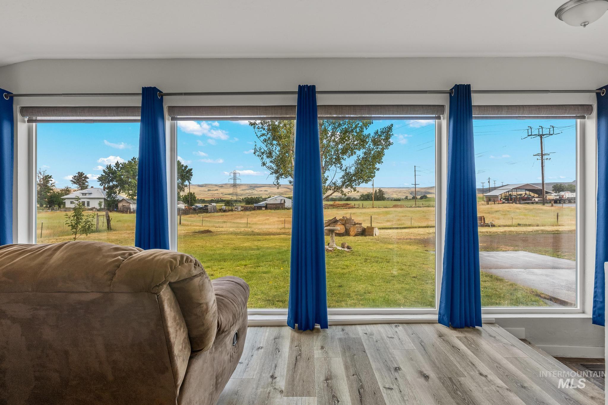 2208 Keithley Creek Road Midvale, ID 83645 - Photo 8 of 45 Doorway to outside with vaulted ceiling and wood finished floors