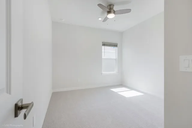 a view of an empty room and a window