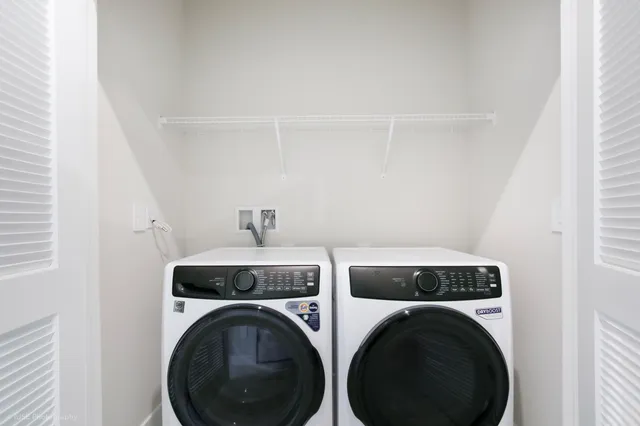 a utility room with dryer and washer