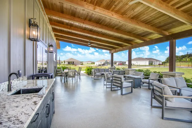 a very nice looking dining room with large windows
