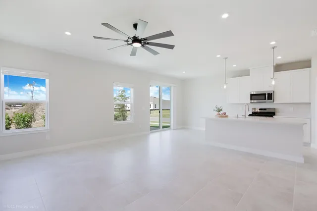 a view of a kitchen with a sink and a window