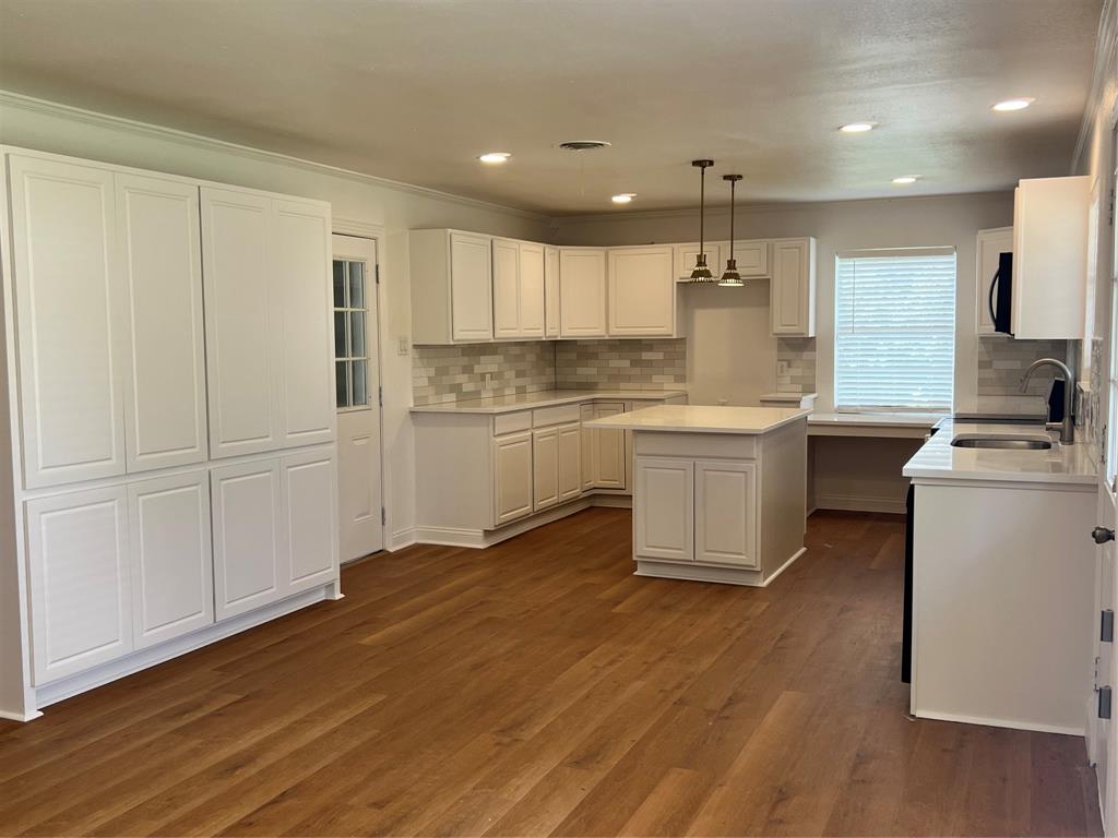 2406 Ridgecrest Drive Garland, TX 75041 - Photo 4 of 22 More cabinets than most kitchen. Plenty of space.