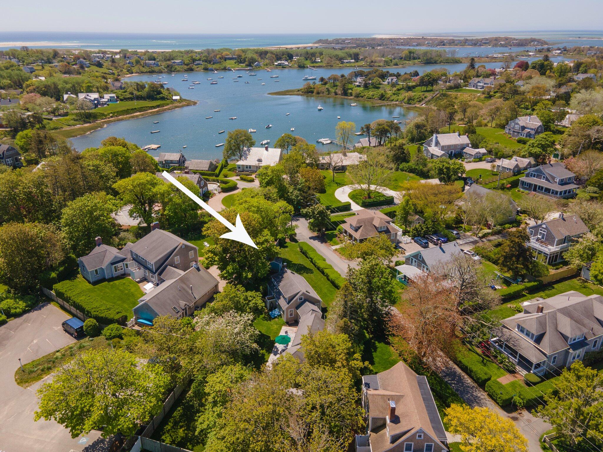 31 Mill Pond Road Chatham, MA 02633 - Photo 12 of 37 an aerial view of residential houses with outdoor space and lake view