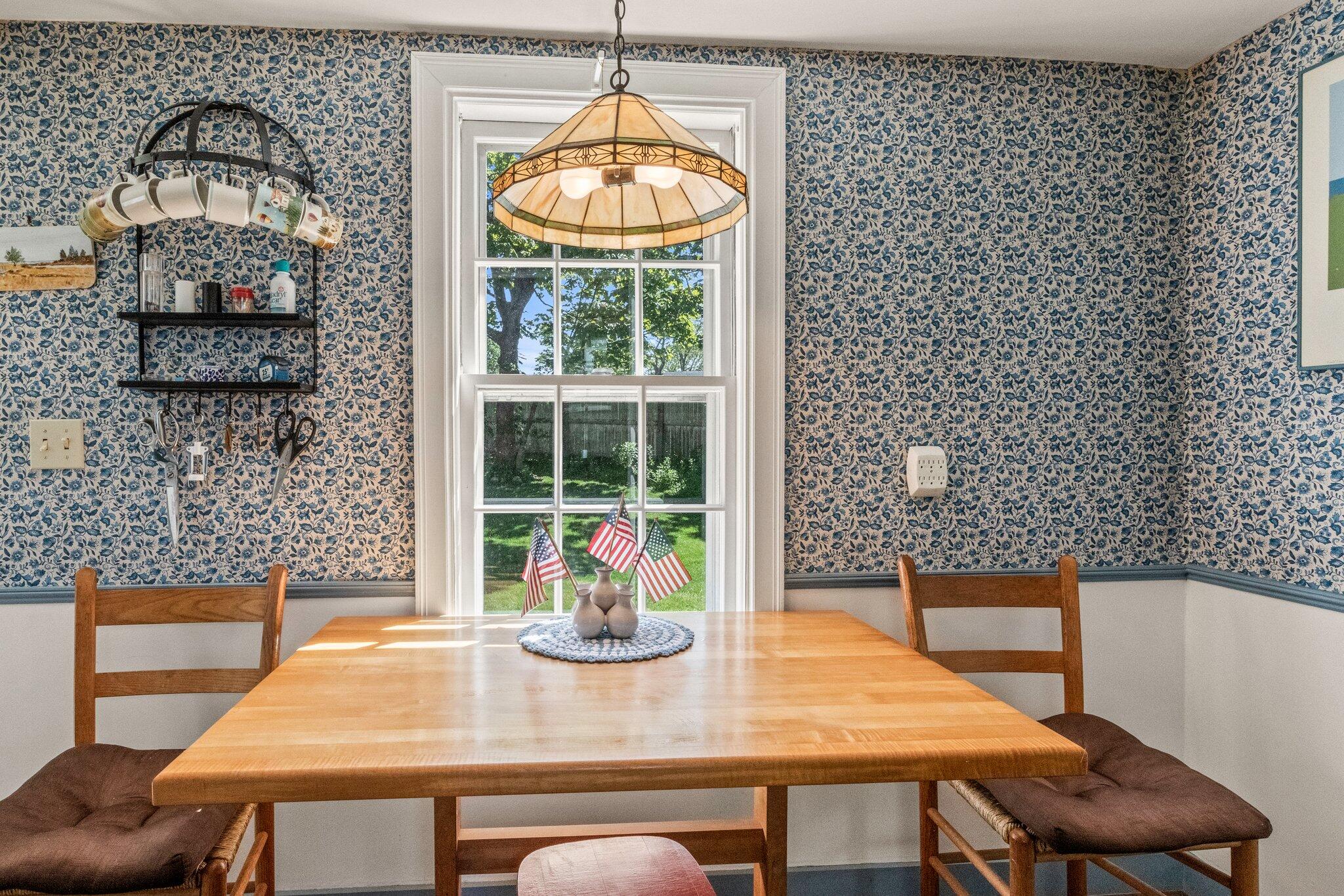 31 Mill Pond Road Chatham, MA 02633 - Photo 15 of 37 a view of a dining room with furniture window and wooden floor