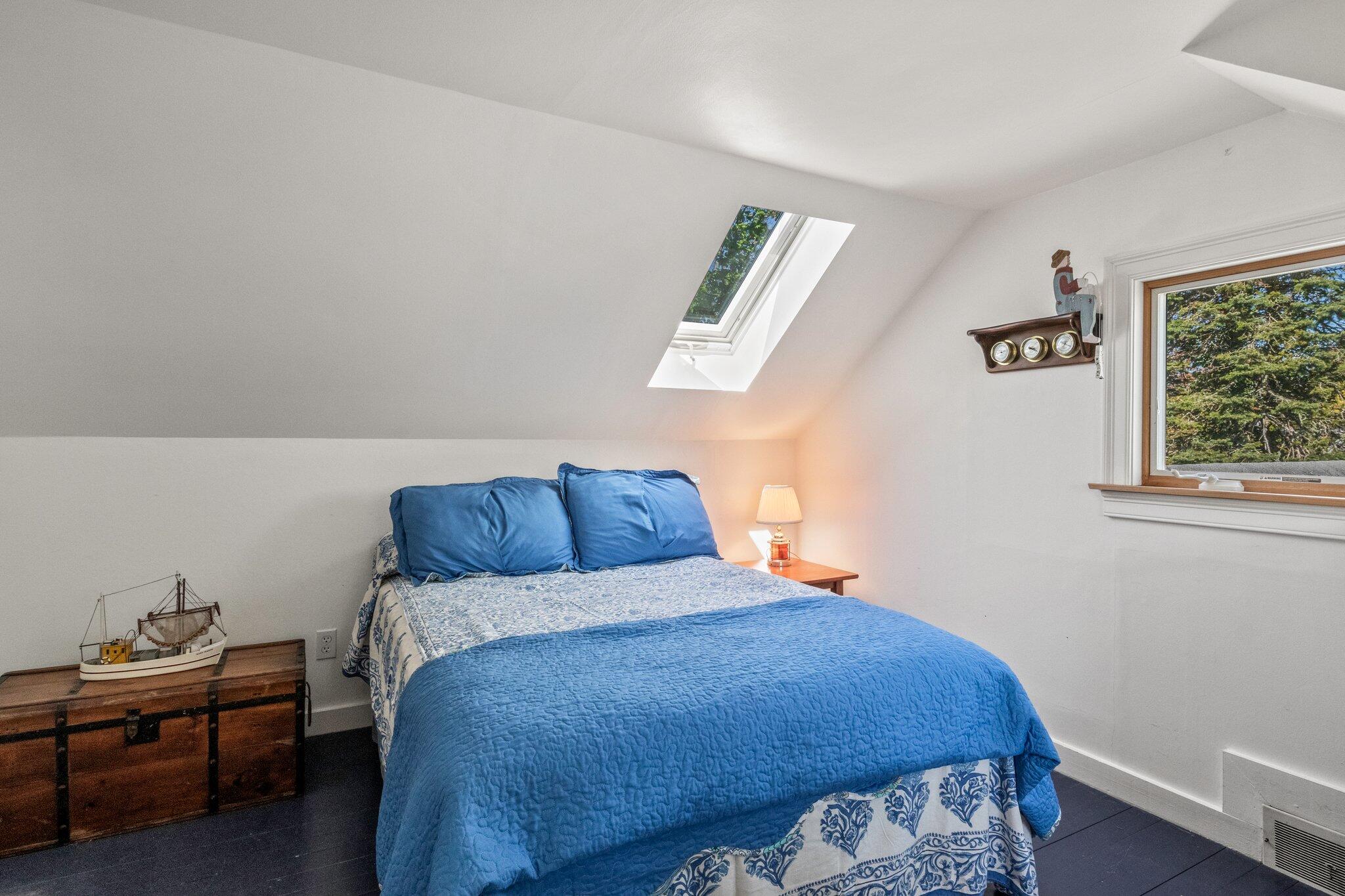 31 Mill Pond Road Chatham, MA 02633 - Photo 19 of 37 a bed sitting in a bedroom next to a window