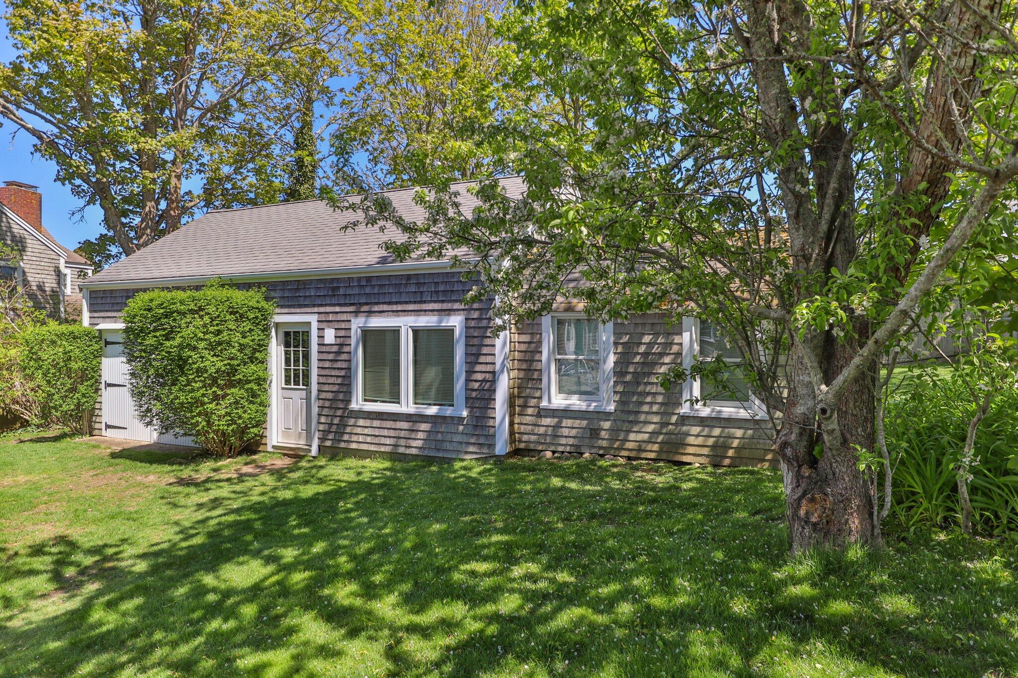 31 Mill Pond Road Chatham, MA 02633 - Photo 22 of 37 front view of a house with a yard