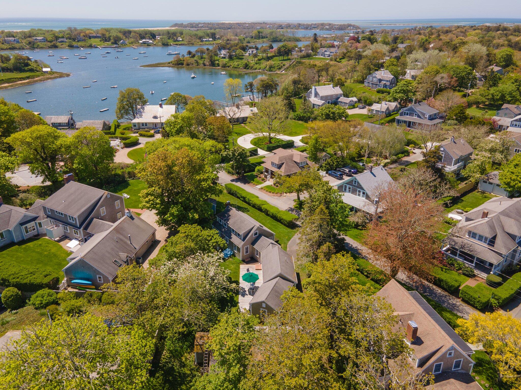 31 Mill Pond Road Chatham, MA 02633 - Photo 27 of 37 an aerial view of lake and residential houses with outdoor space
