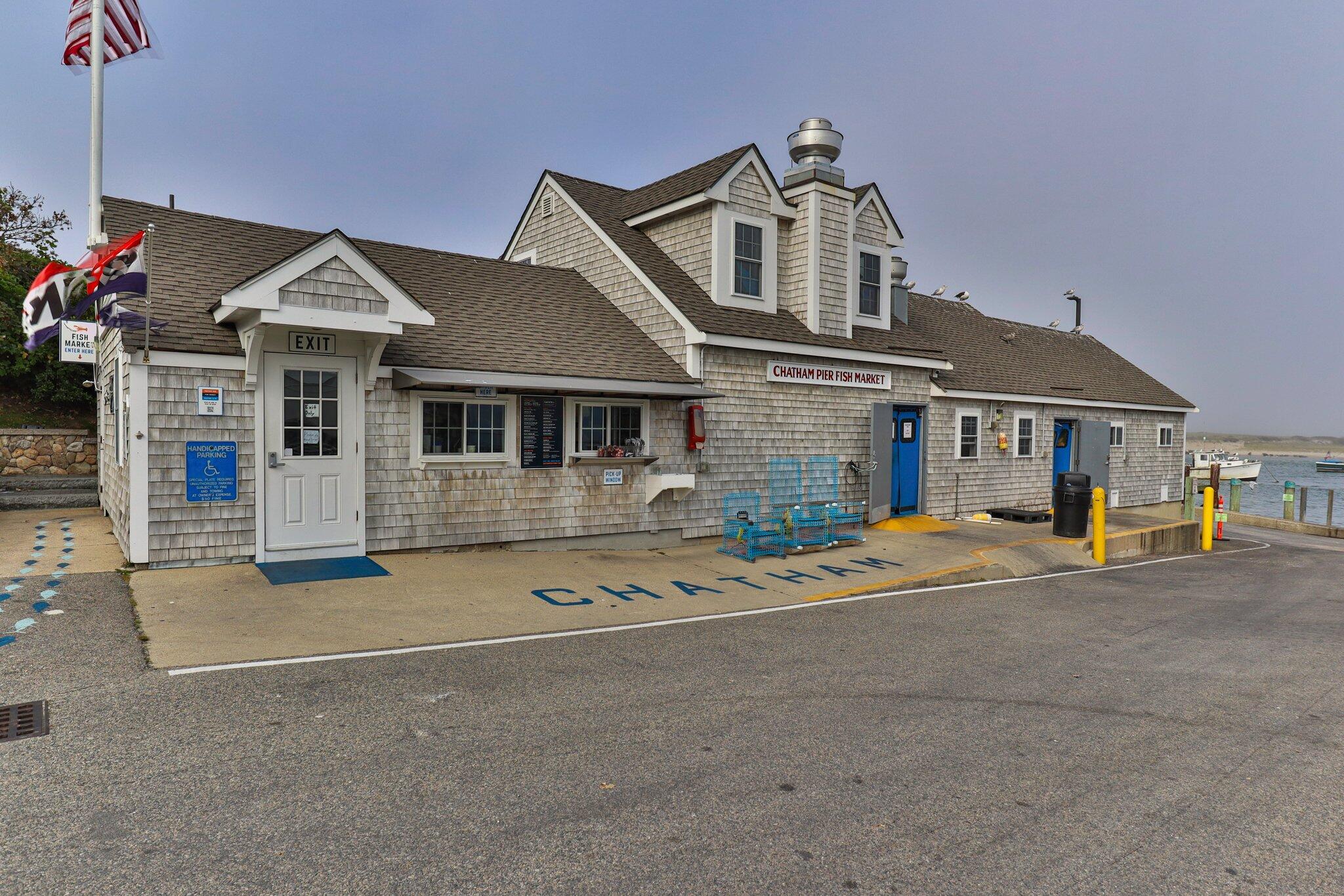 31 Mill Pond Road Chatham, MA 02633 - Photo 36 of 37 a front view of a house with a yard