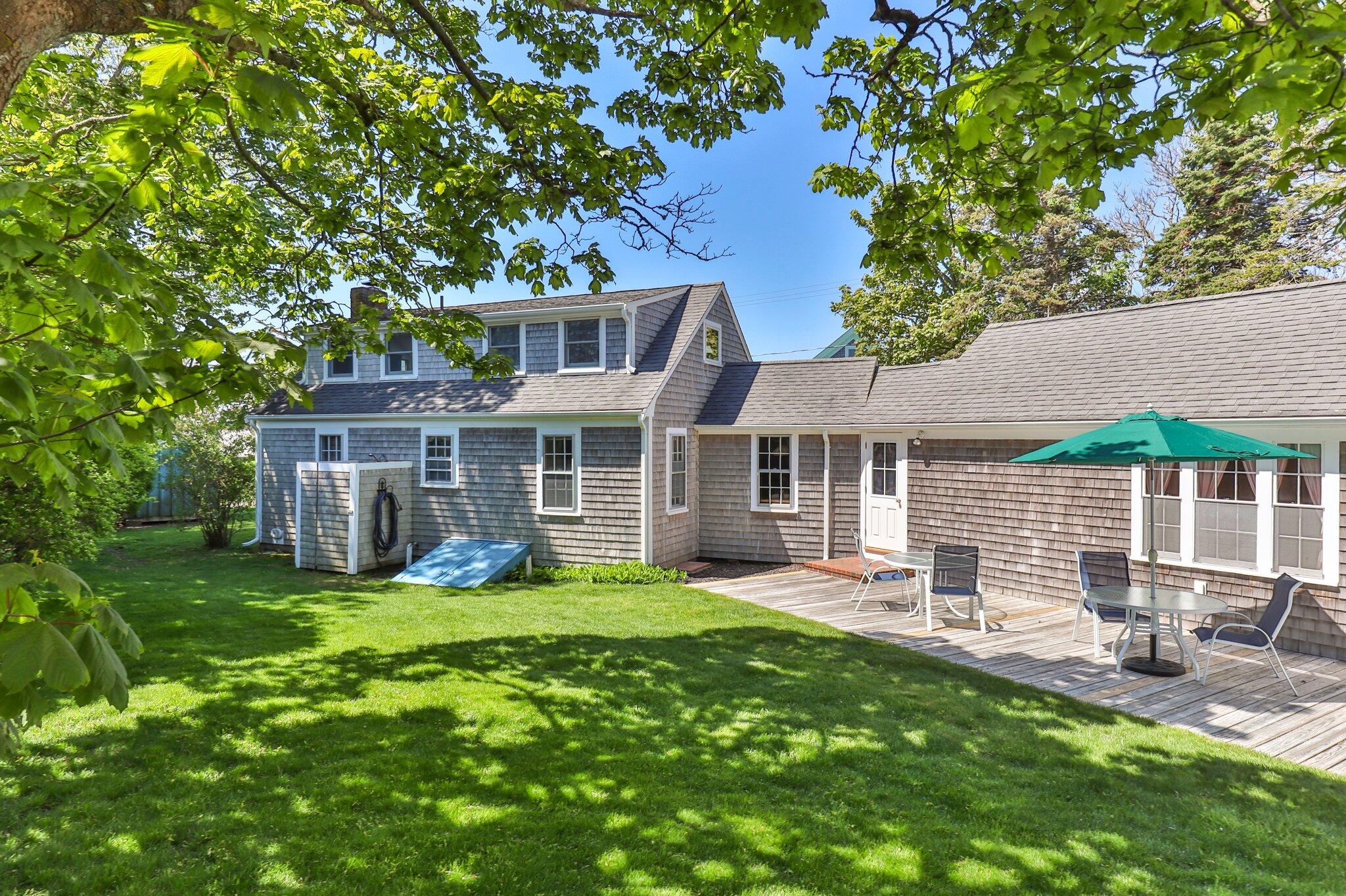 31 Mill Pond Road Chatham, MA 02633 - Photo 9 of 37 front view of a house with a yard