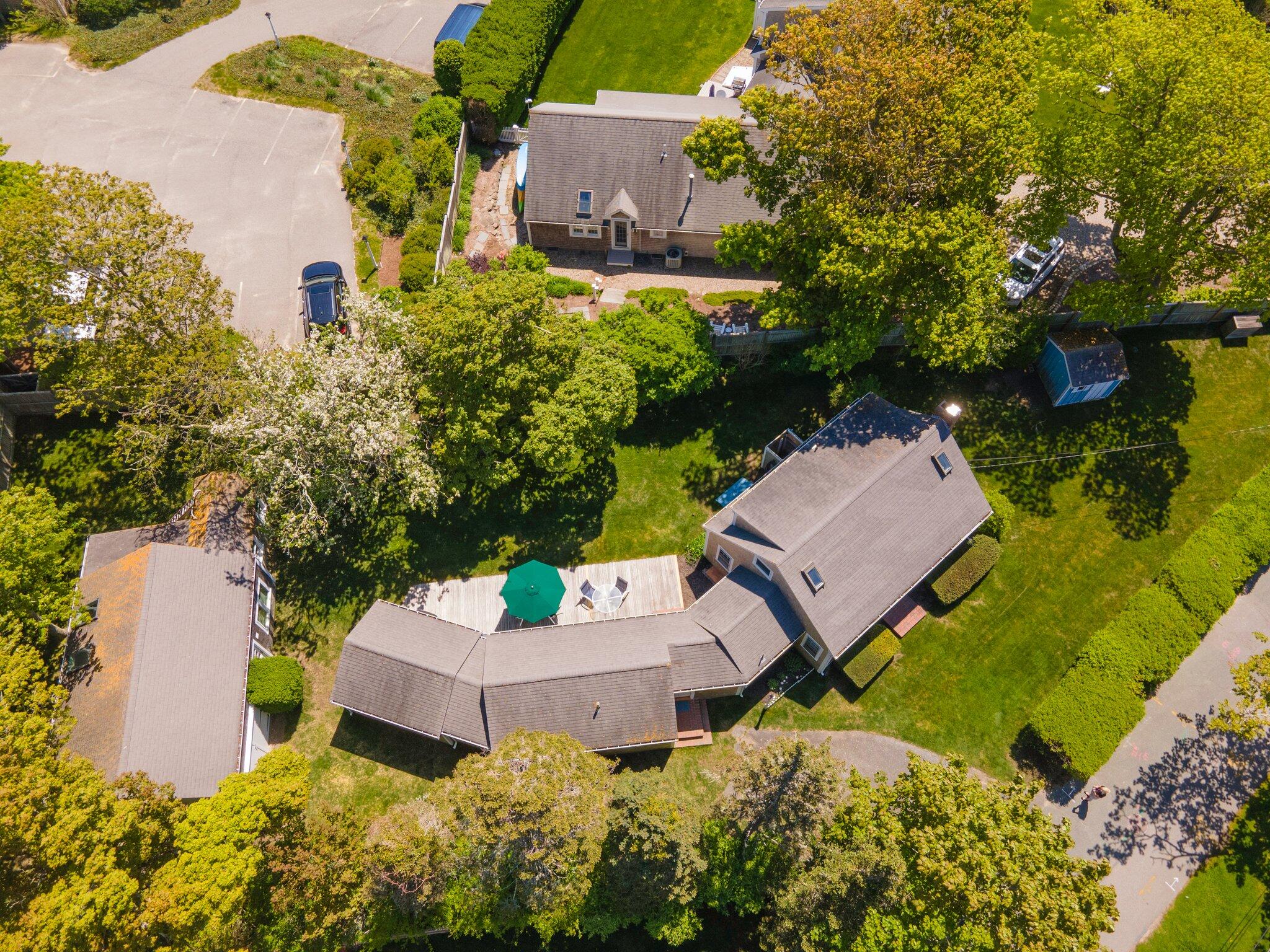 31 Mill Pond Road Chatham, MA 02633 - Photo 10 of 37 an aerial view of a house with a garden and swimming pool