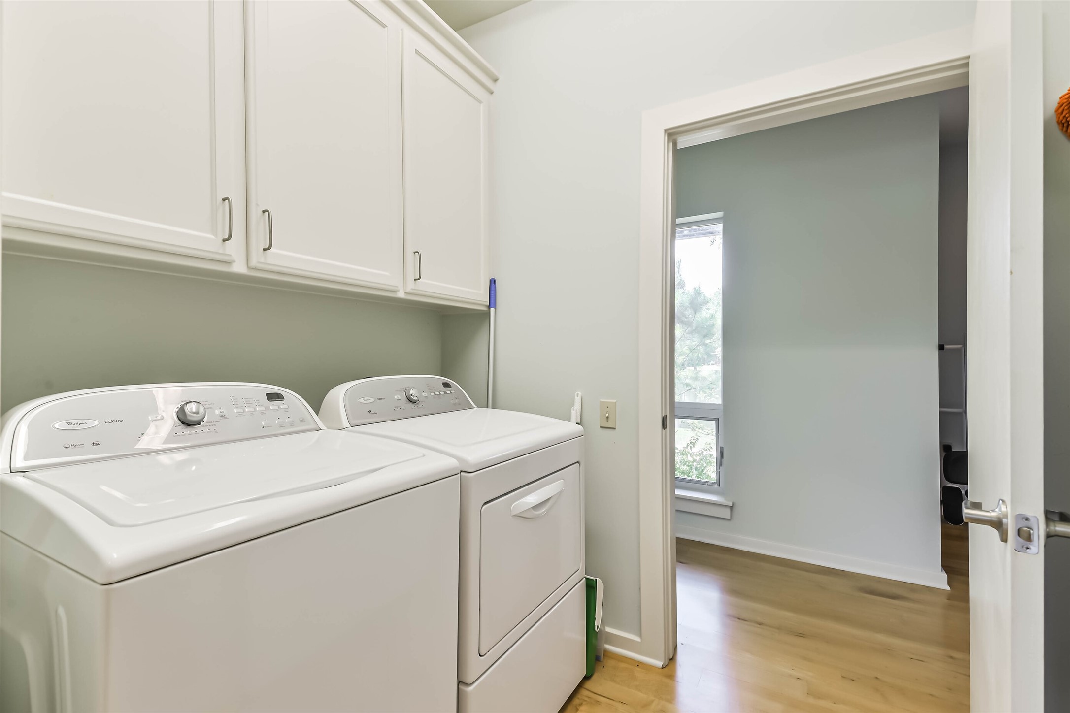 88 Raccoon Ramble Cleveland, TX 77327 - Photo 20 of 43 Effortlessly manage your household chores in this bright, well-organized utility room featuring modern appliances and ample storage.