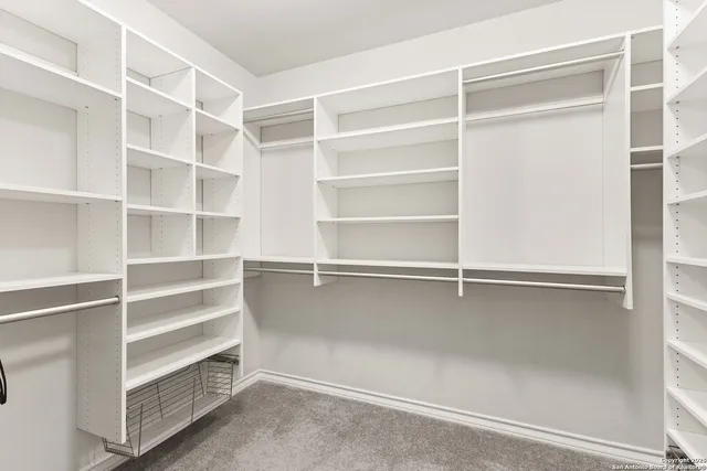 a view of an empty walk in closet