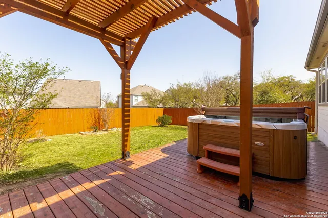 a view of swimming pool with a patio and wooden floor