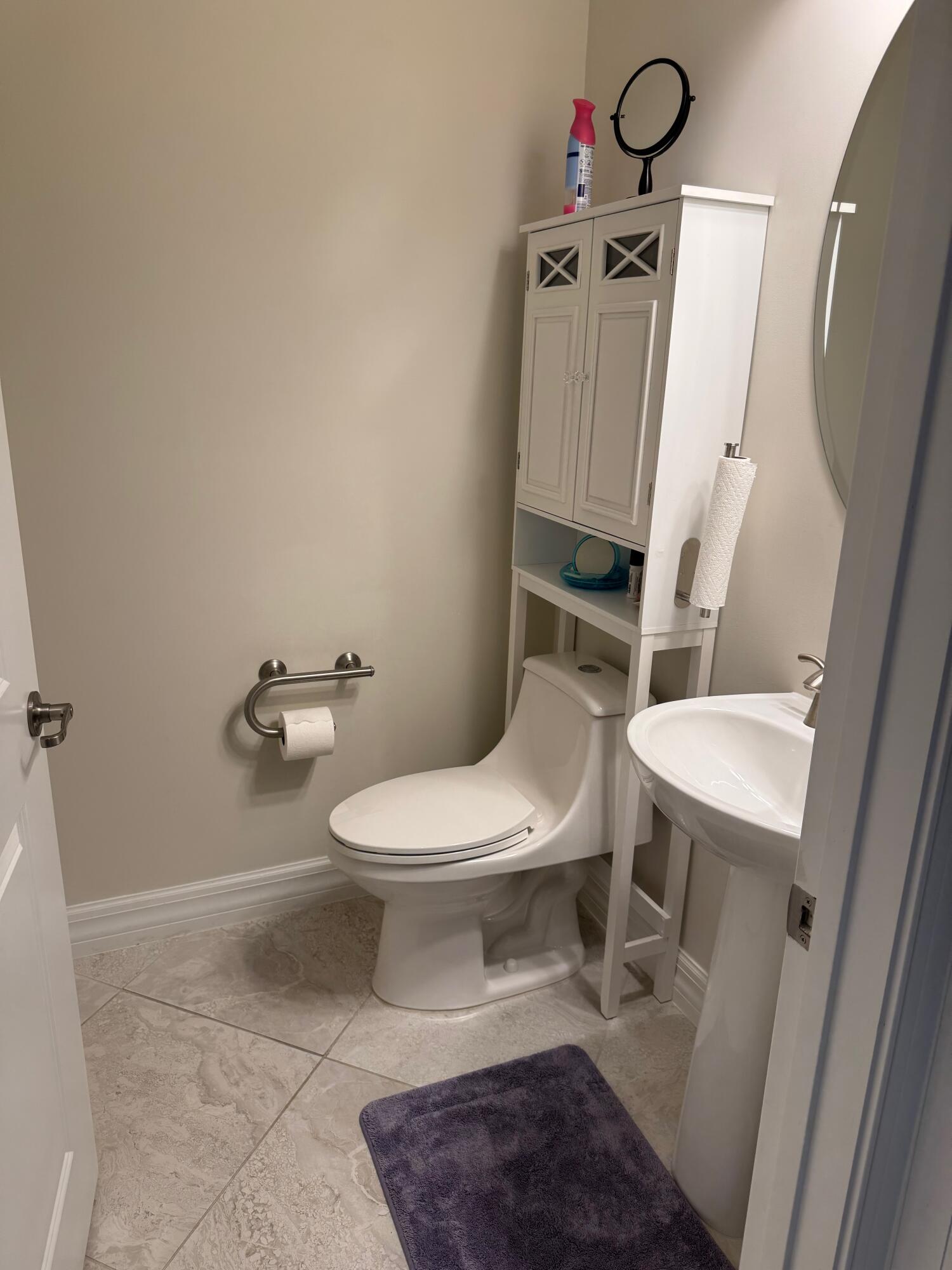 21872 Canadensis Circle, Unit 202 Boca Raton, FL 33428 - Photo 15 of 43 half bathroom