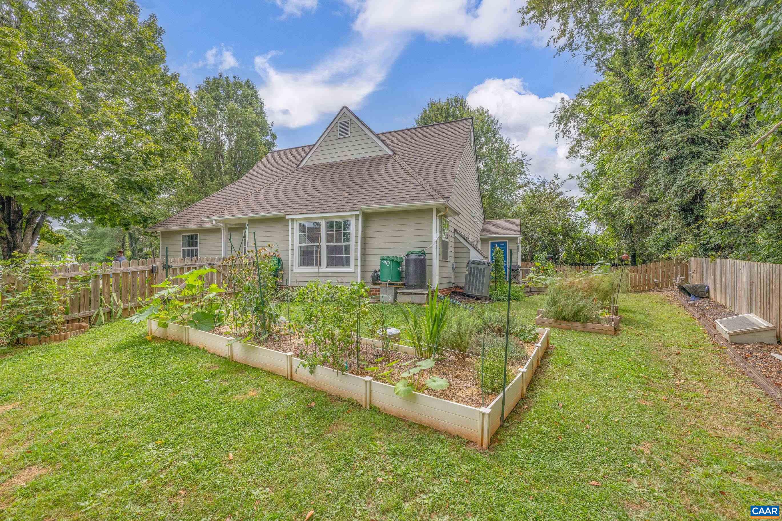 1254 Clover Ridge Place Charlottesville, VA 22901 - Photo 2 of 16 a view of a house with a yard patio and a garden