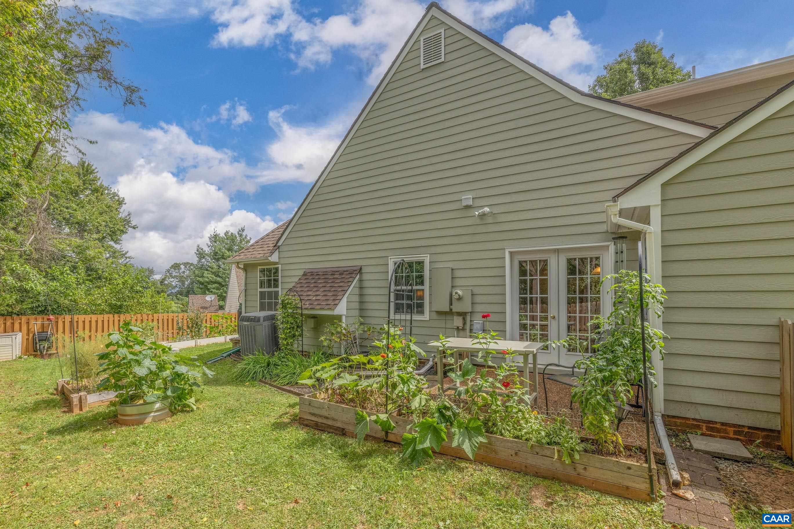 1254 Clover Ridge Place Charlottesville, VA 22901 - Photo 3 of 16 a view of backyard with a garden and plants