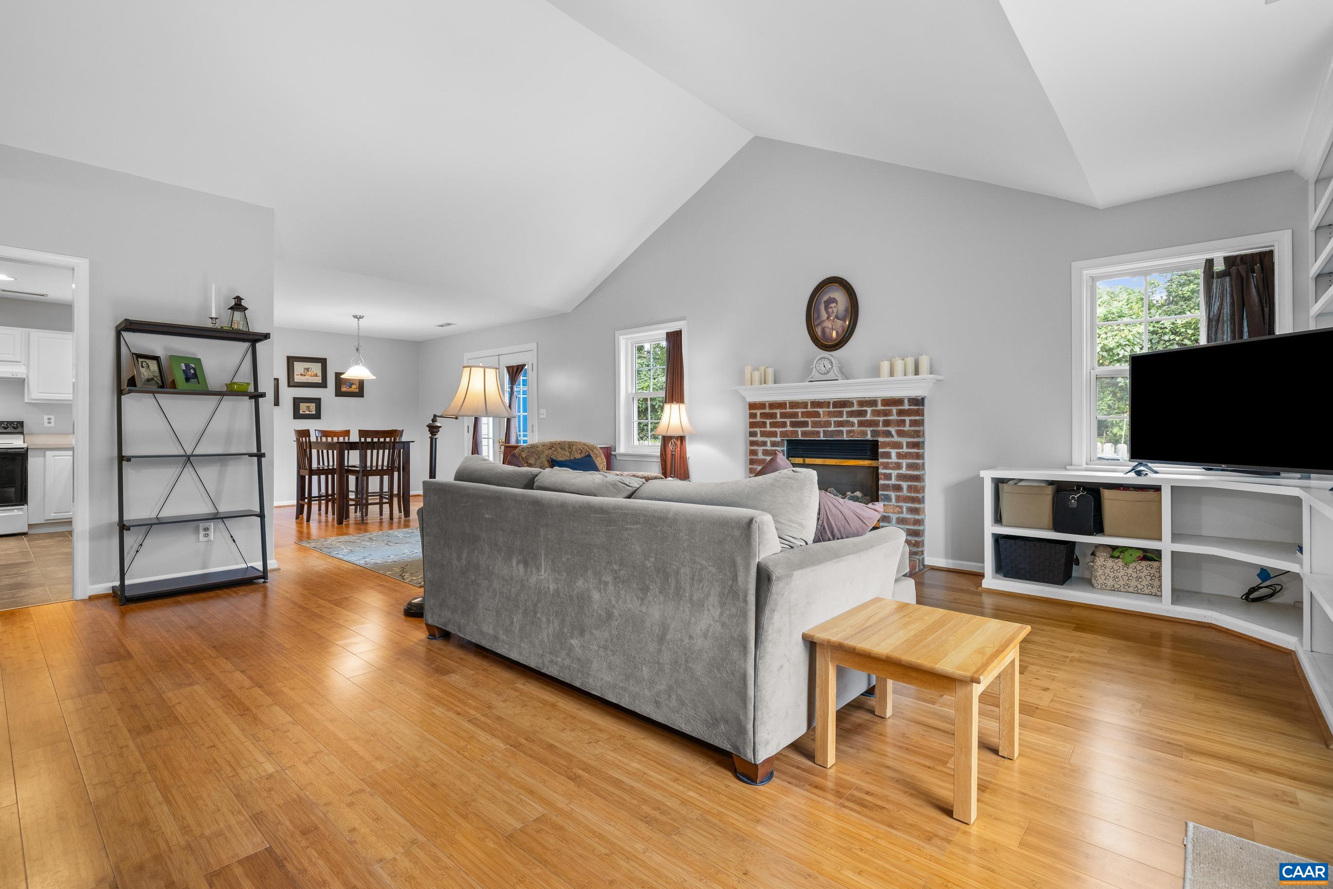 1254 Clover Ridge Place Charlottesville, VA 22901 - Photo 5 of 16 a living room with furniture flat screen tv and a fireplace