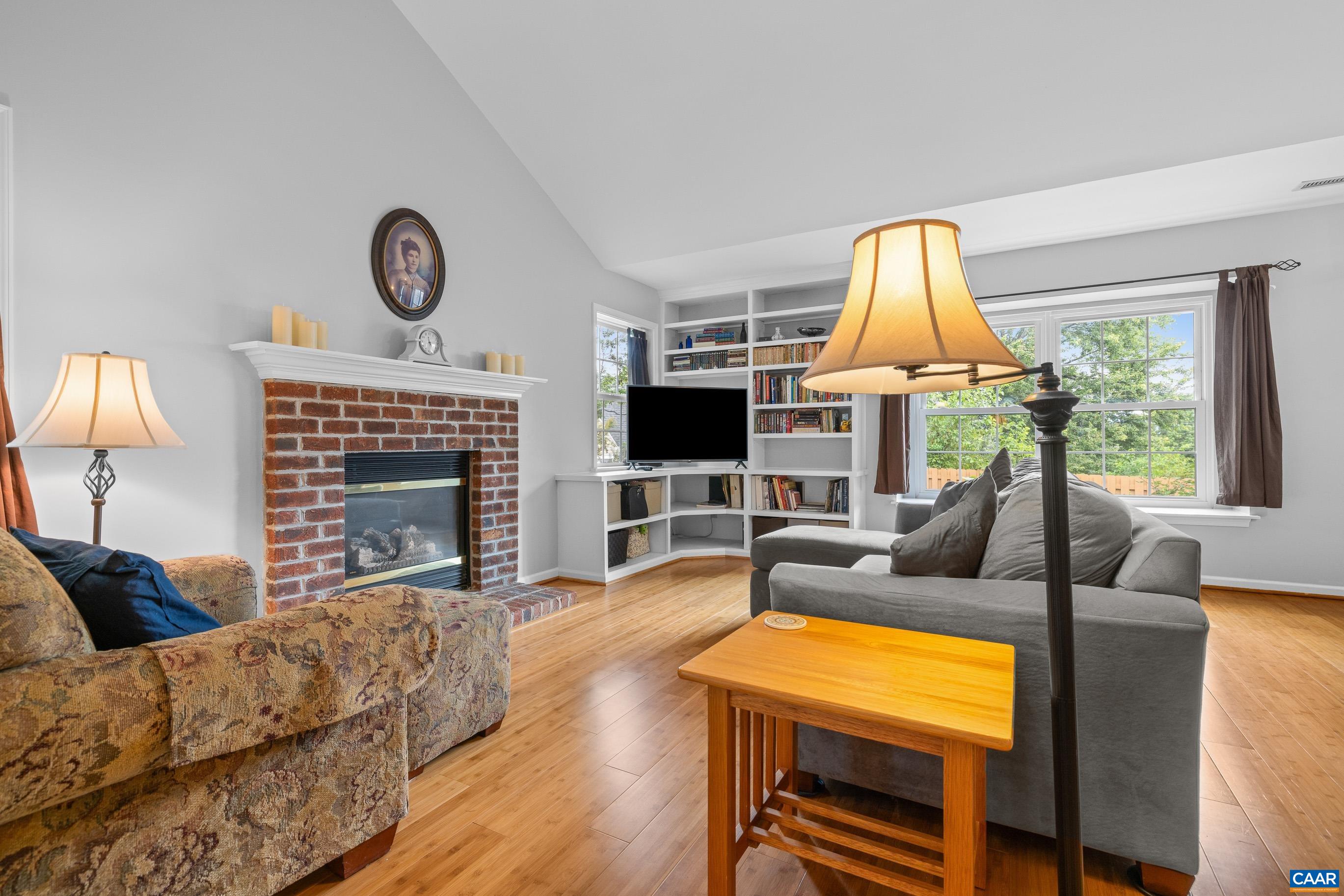 1254 Clover Ridge Place Charlottesville, VA 22901 - Photo 6 of 16 a living room with fireplace furniture and a flat screen tv