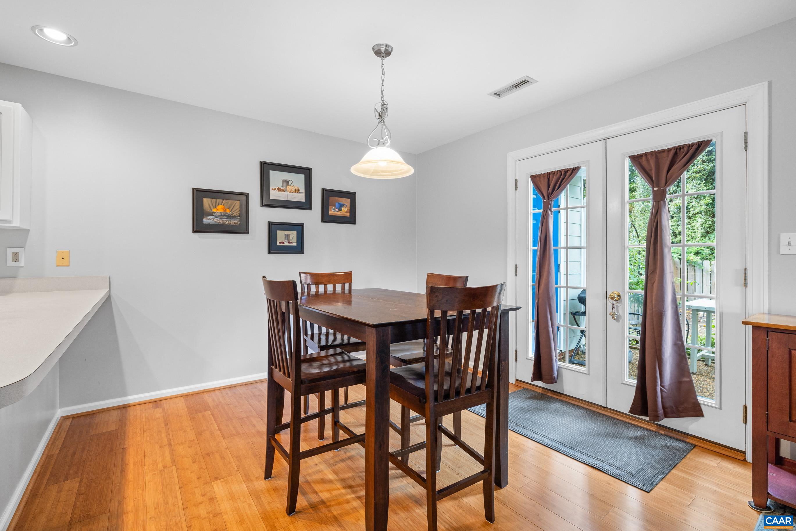1254 Clover Ridge Place Charlottesville, VA 22901 - Photo 7 of 16 a view of a dining room with furniture window and wooden floor