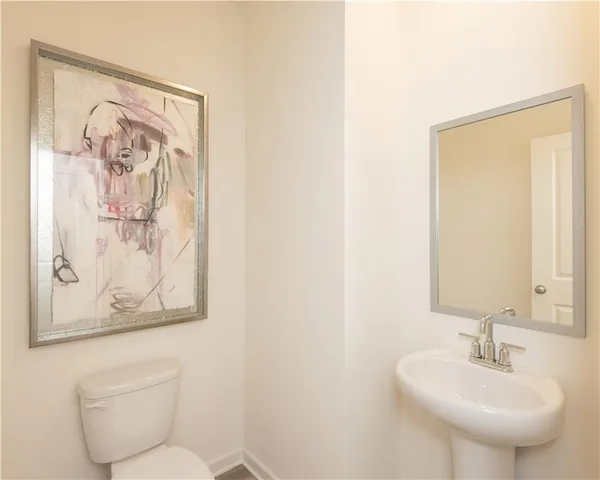 a bathroom with a toilet and a sink