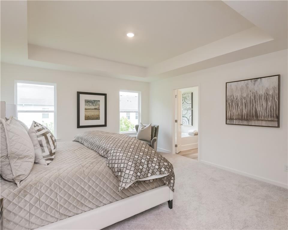 1819 Dawn Road, Unit 16 Conyers, GA 30013 - Photo 21 of 28 a bedroom with a large bed and a window