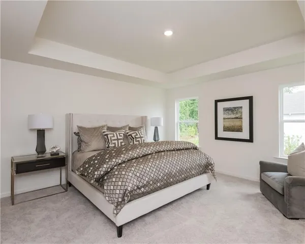 a bedroom with a bed and a couch