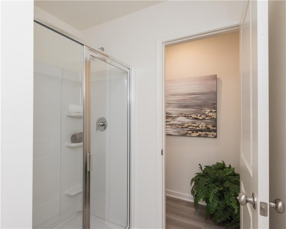 1819 Dawn Road, Unit 16 Conyers, GA 30013 - Photo 27 of 28 a bathroom with a shower and a plant