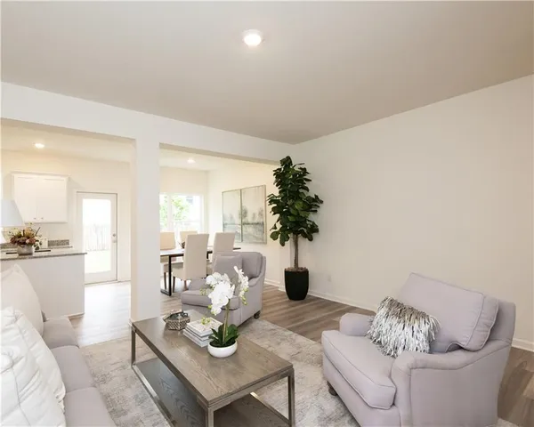 a living room with furniture and a table