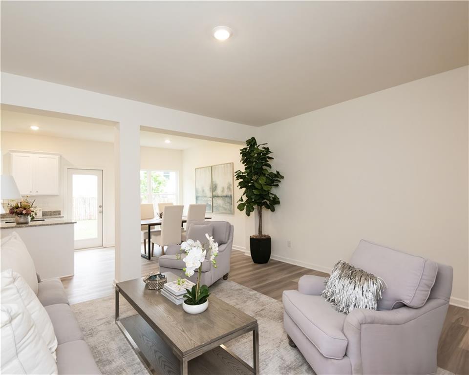1819 Dawn Road, Unit 16 Conyers, GA 30013 - Photo 4 of 28 a living room with furniture and a table