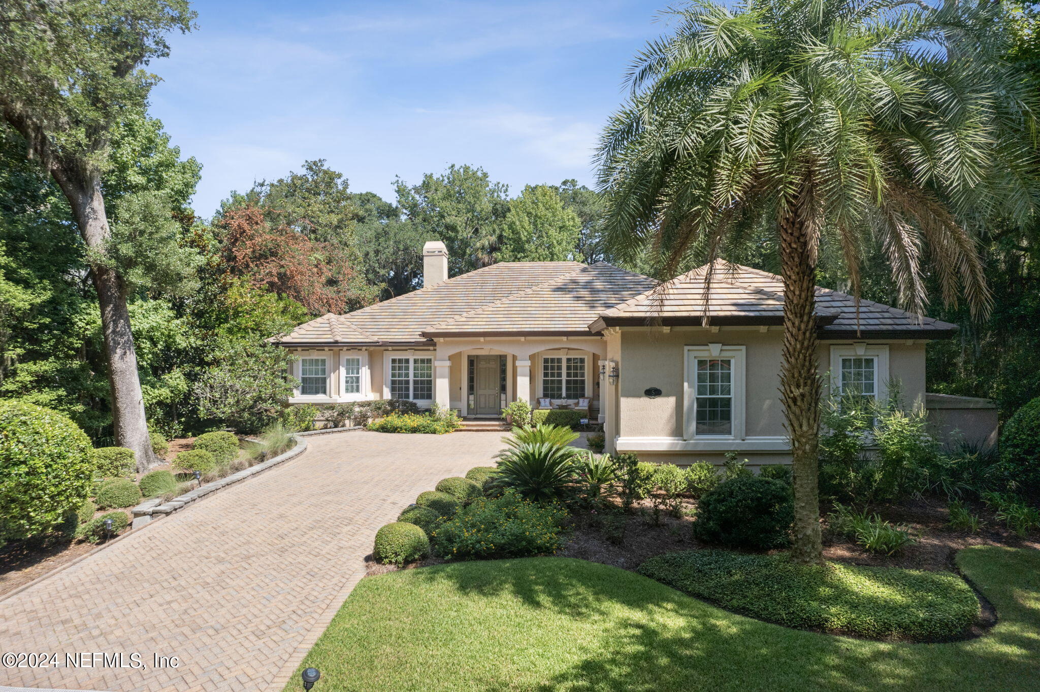 5 Sea Marsh Road Fernandina Beach, FL 32034 - Photo 1 of 71 a front view of a house with a yard and trees