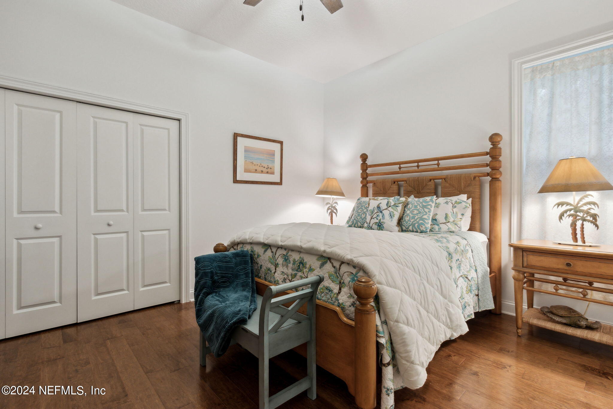 5 Sea Marsh Road Fernandina Beach, FL 32034 - Photo 38 of 71 a bedroom with a bed and a lamp on dresser