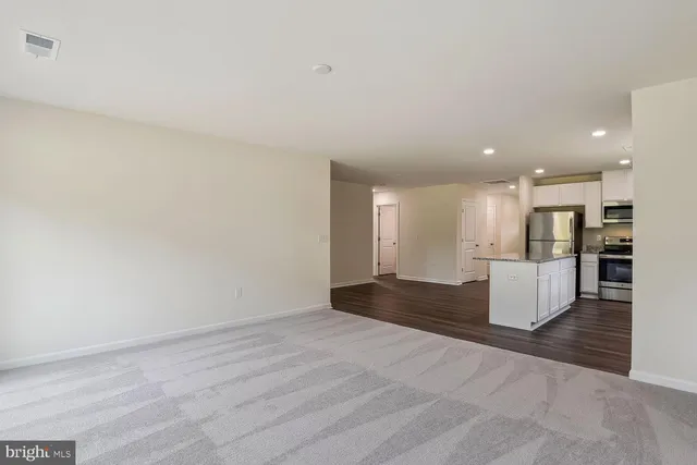 a view of kitchen with wooden floor