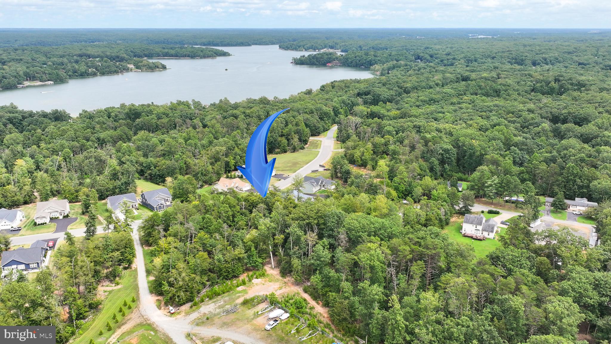 Lot 39 Sunset Loop Mineral, VA 23117 - Photo 5 of 15 a aerial view of a house with a yard and lake view