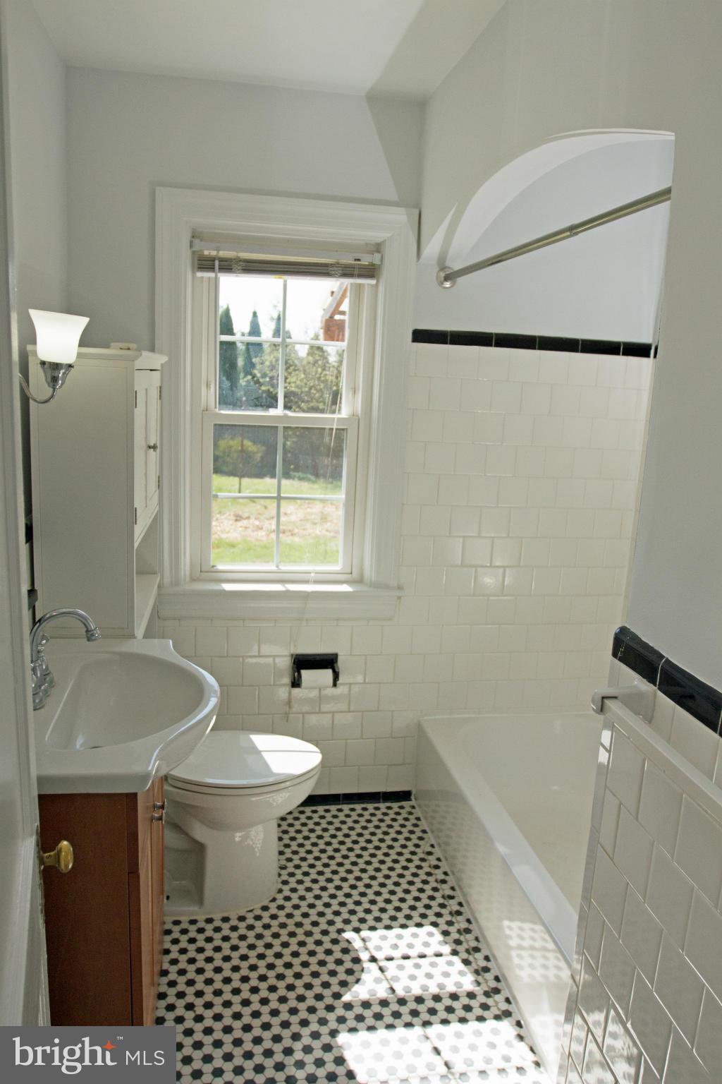 5303 Glen Falls Road Reisterstown, MD 21136 - Photo 17 of 30 a bathroom with a sink toilet and shower