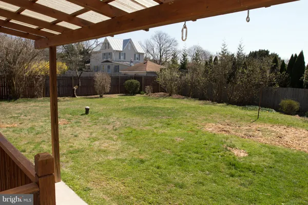 a view of a backyard of the house