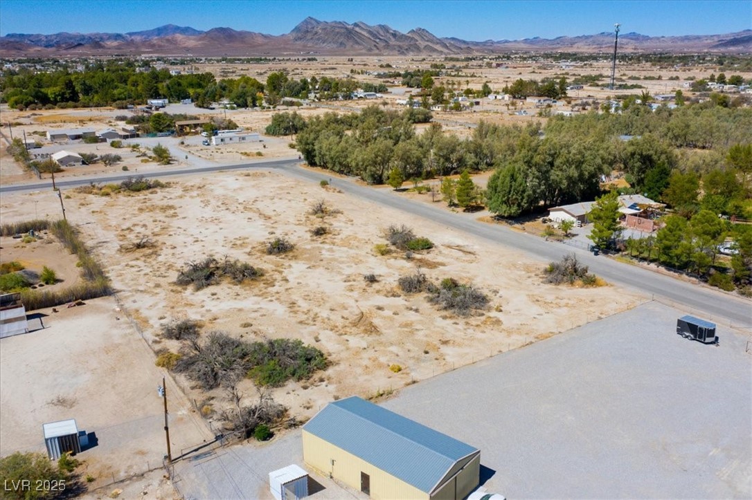 1921 West Dyer Road Pahrump, NV 89048 - Photo 16 of 28 Aerial view of sparsely populated area featuring a mountain backdrop