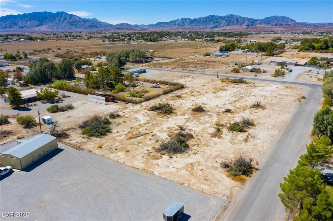 1921 West Dyer Road Pahrump, NV 89048 - Photo 18 of 28 Aerial view of sparsely populated area with a desert landscape and a mountainous background