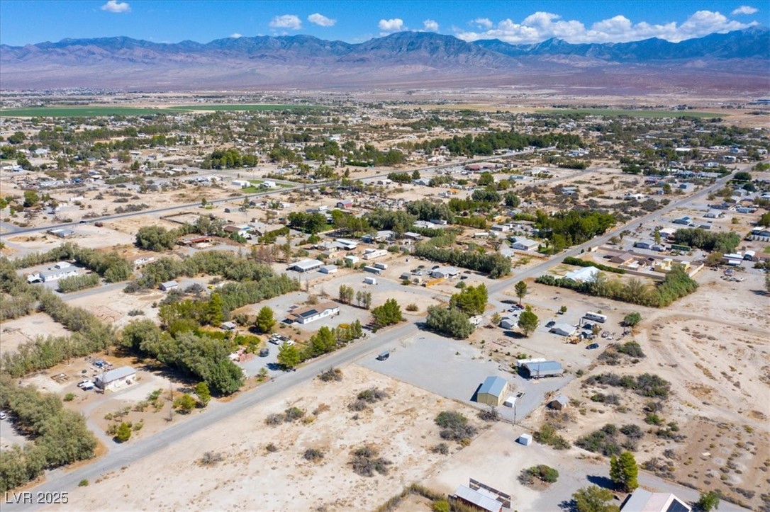 1921 West Dyer Road Pahrump, NV 89048 - Photo 22 of 28 Drone / aerial view of a desert landscape and a mountainous background