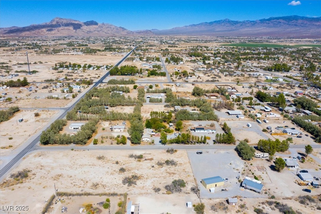 1921 West Dyer Road Pahrump, NV 89048 - Photo 23 of 28 Aerial view of sparsely populated area with a desert landscape and mountains