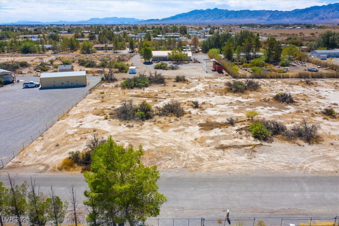1921 West Dyer Road Pahrump, NV 89048 - Photo 10 of 28 Aerial view of sparsely populated area with mountains and a desert landscape