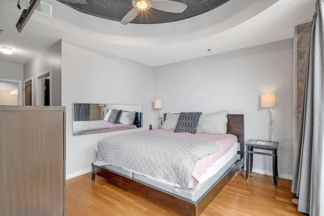 a bed room with a bed and a television